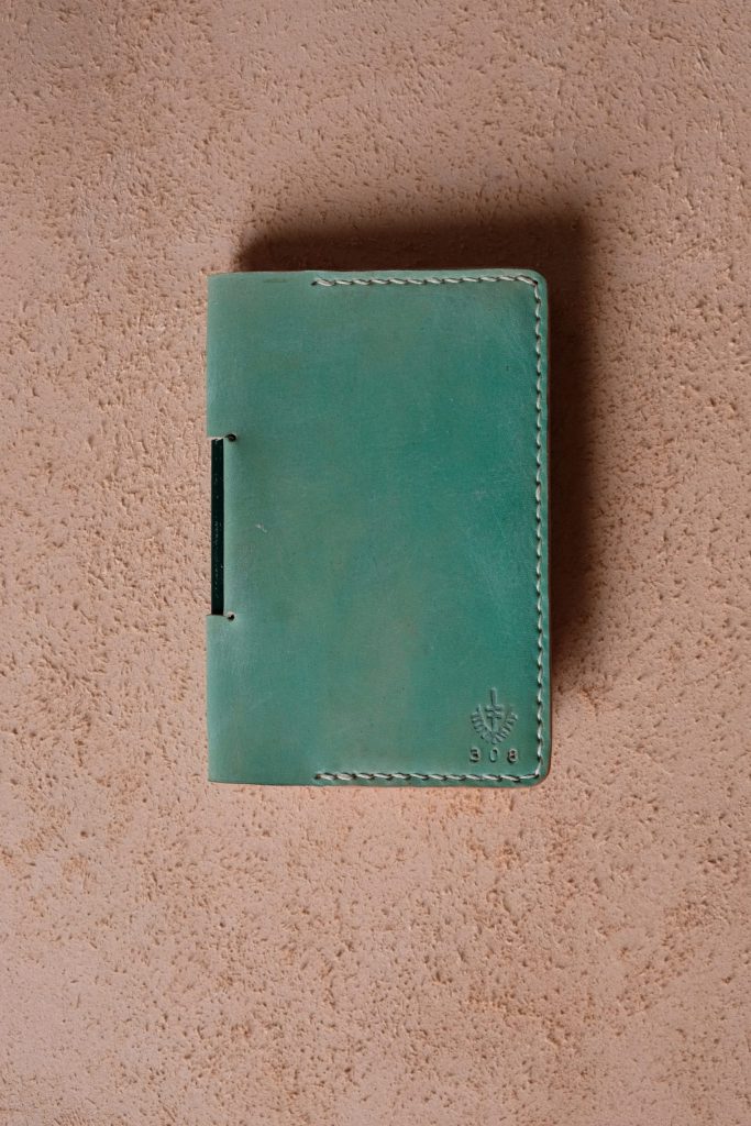 Lerif Designs Leather Notebook Etuis in Pistachio on Beige Background