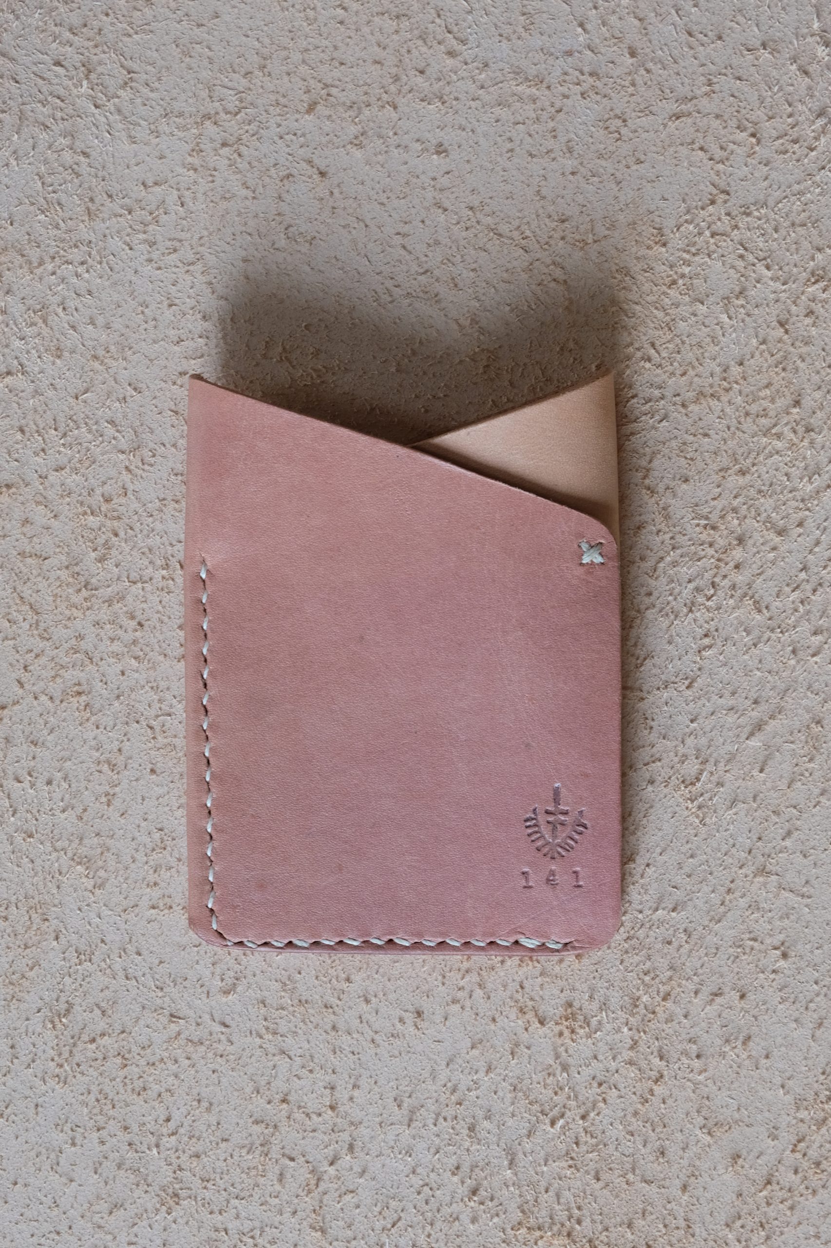 lerif designs leather fox ears cardholder in red beet on beige background