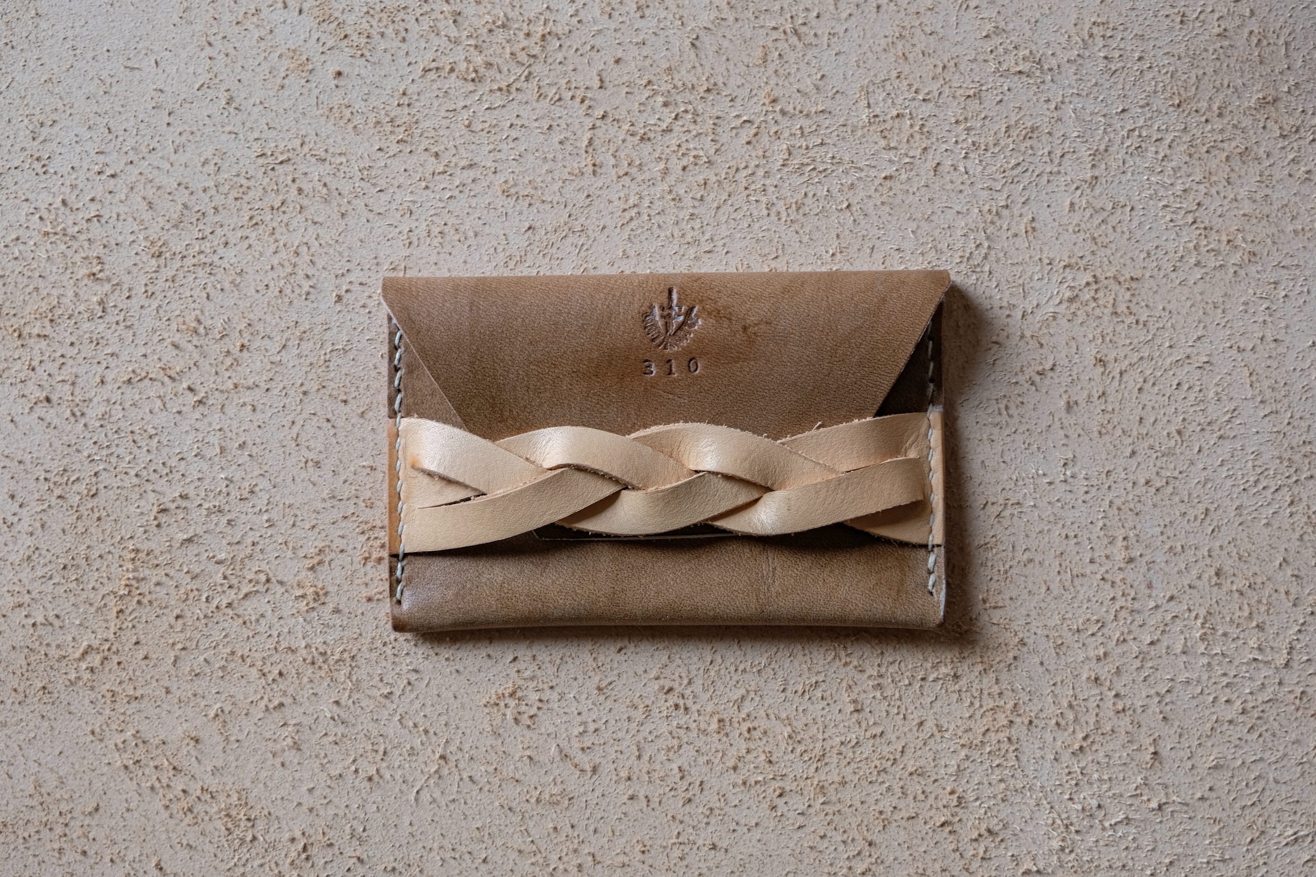 lerif designs leather magic braid cardholder walnut and natural on beige background