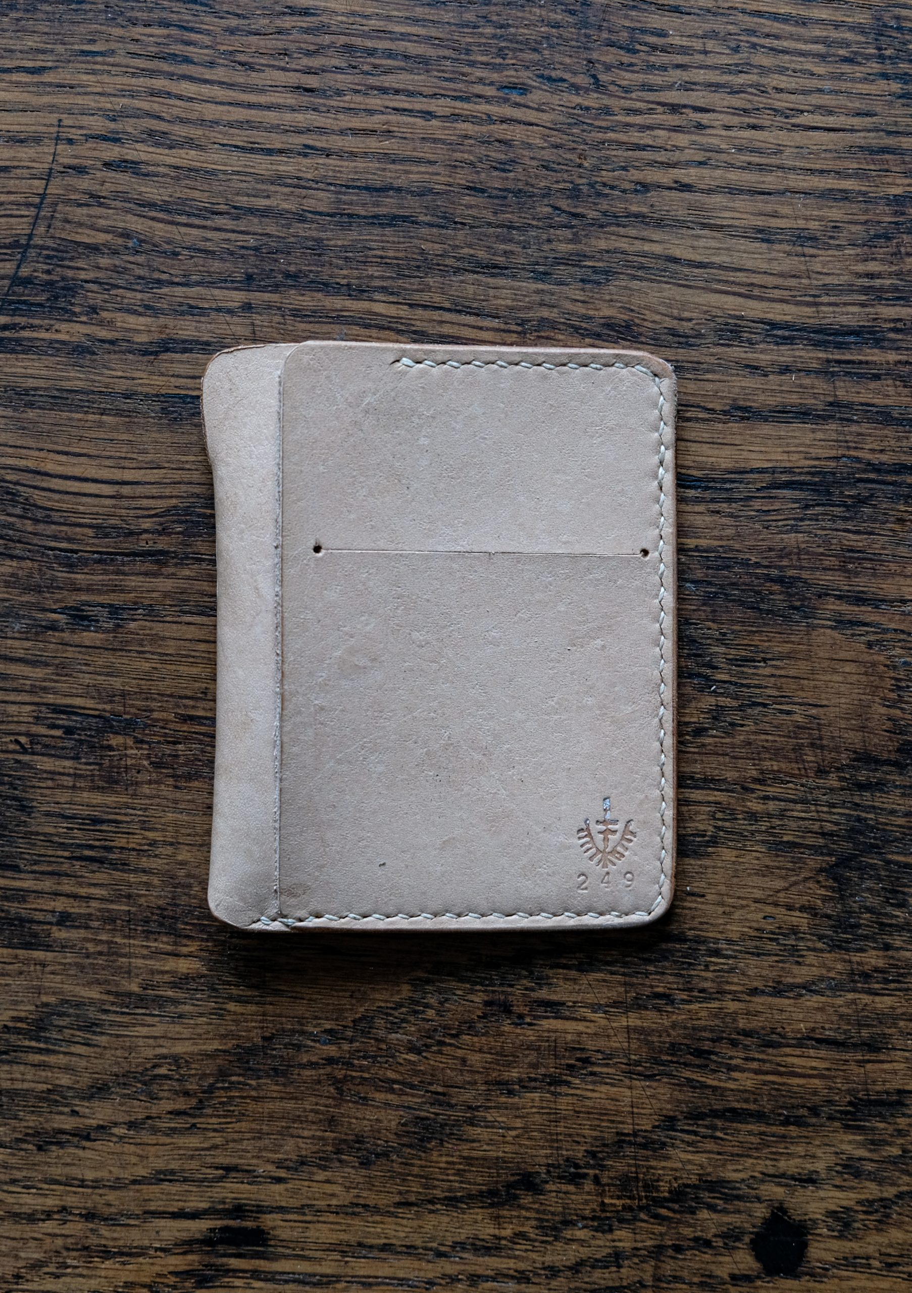 lerif designs vale card holder tour1-2 lerif designs Vale leather wallet in natural on wood background