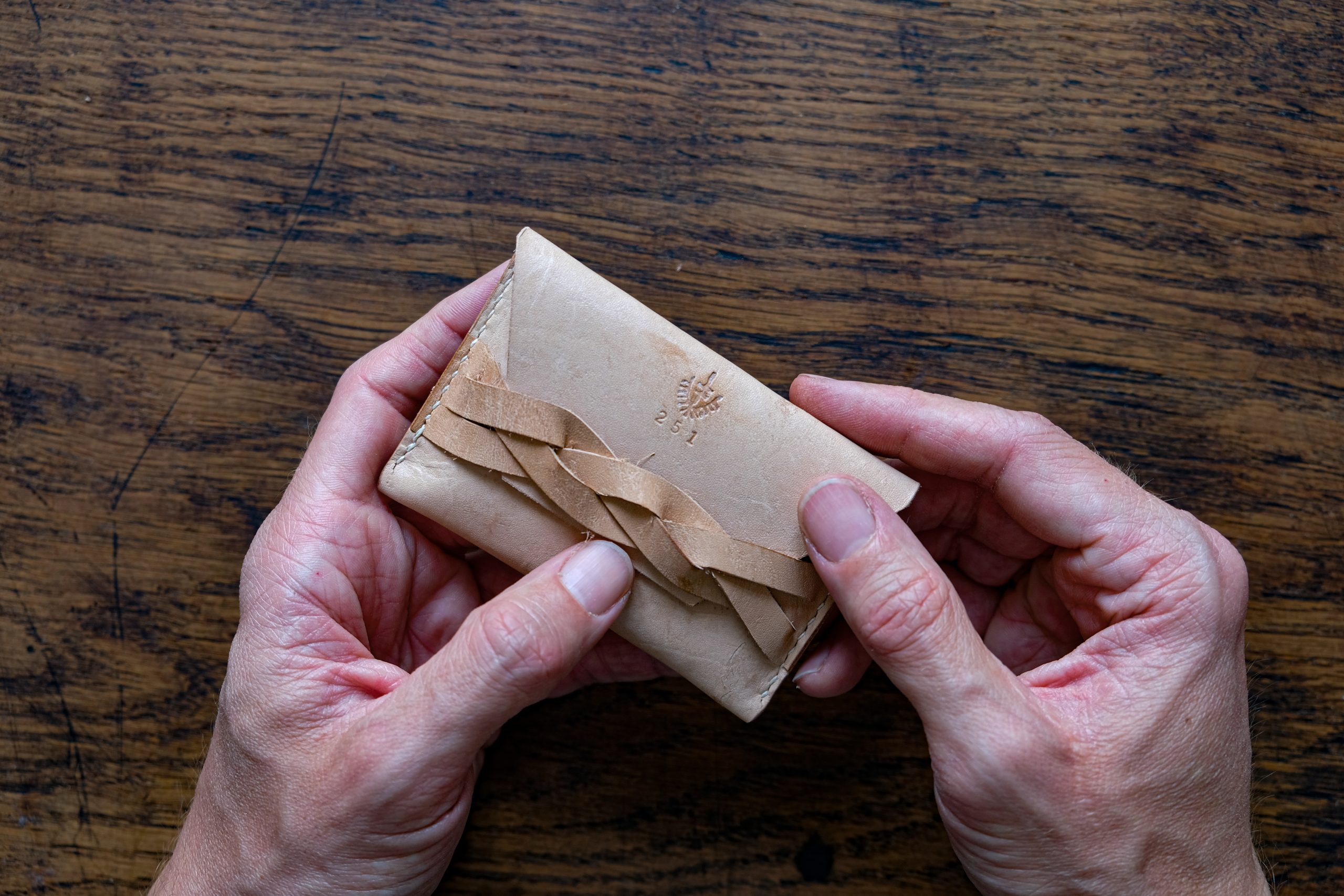 lerif designs leather magic braid cardholder demo on wood background